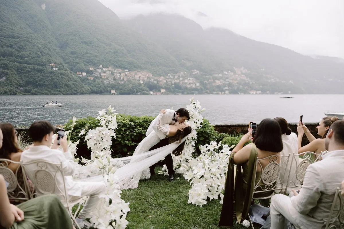 Destination wedding ceremony in Italy — first kiss by the lake
