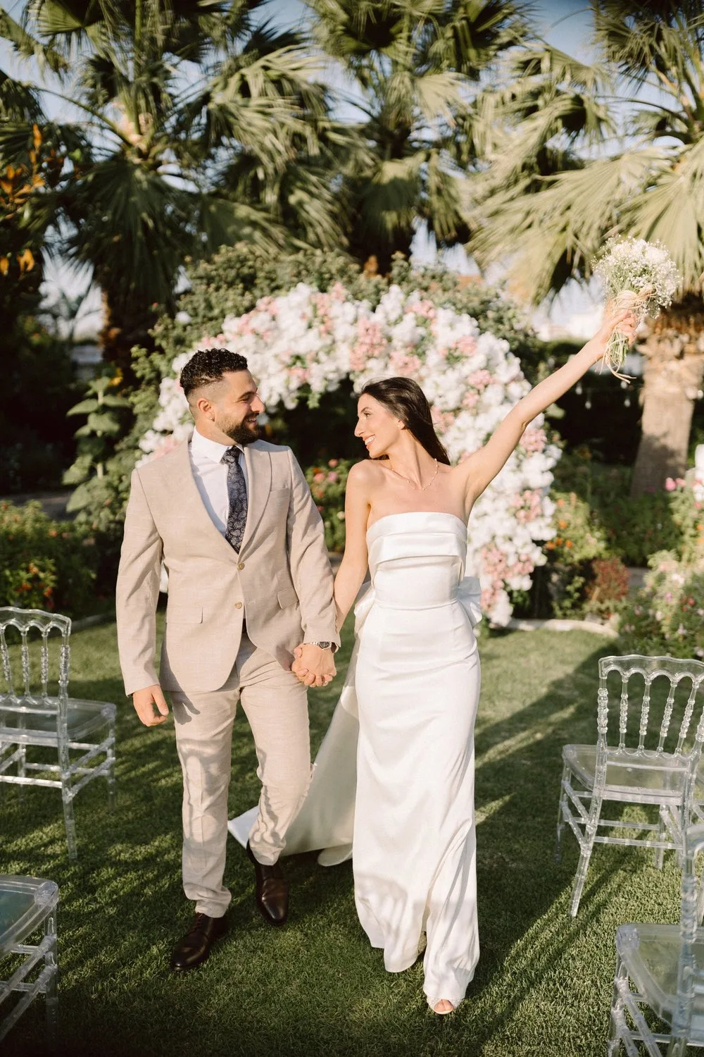 Cyprus wedding photographer — couple walking hand in hand through olive groves